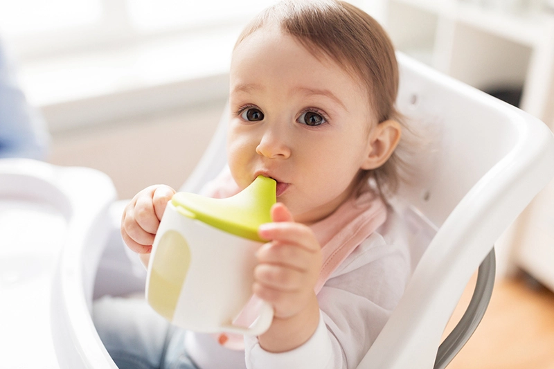 Child with sippy cup