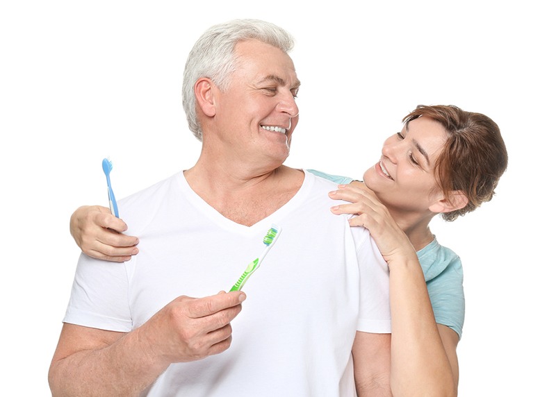 Senior couple with toothbrushes